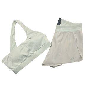 Light teal sports bra with shorts set.